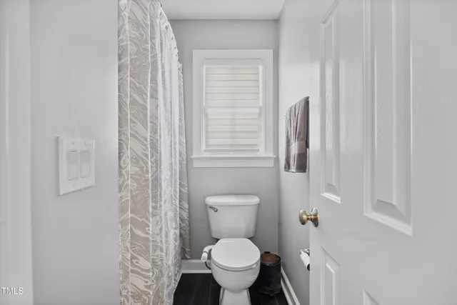 a bedroom with a bed and a desk