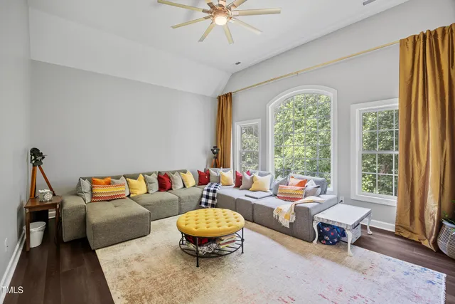 a bathroom with double vanity and a mirror