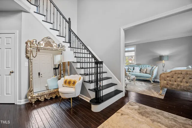 a view of entryway and hall with wooden floor
