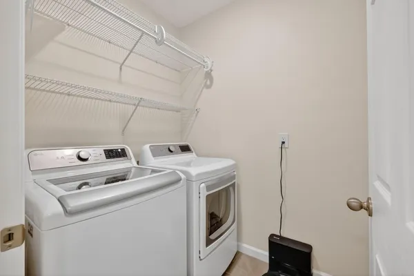 a utility room with dryer and washer