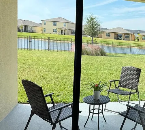 a view of a chair and table in the deck
