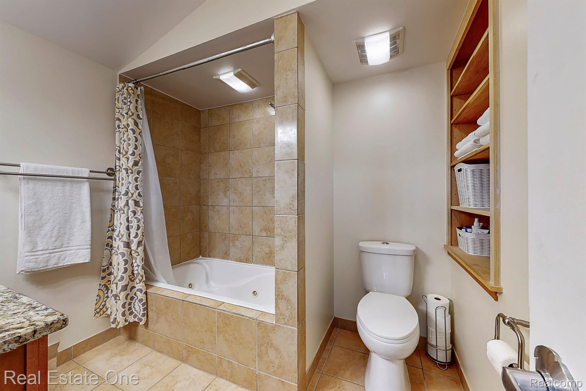7448 Sharp Road Swartz Creek, MI 48473 - Photo 15 of 49 Primary bath has custom tile and jetted tub.