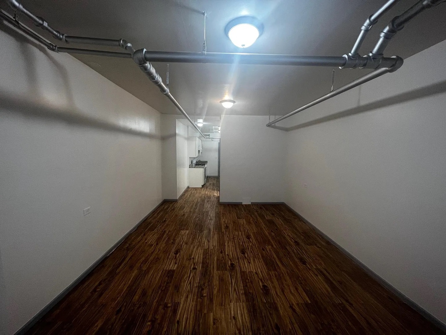 4304 West Shakespeare Avenue Chicago, IL 60639 - Photo 3 of 6 a view of a room with wooden floor