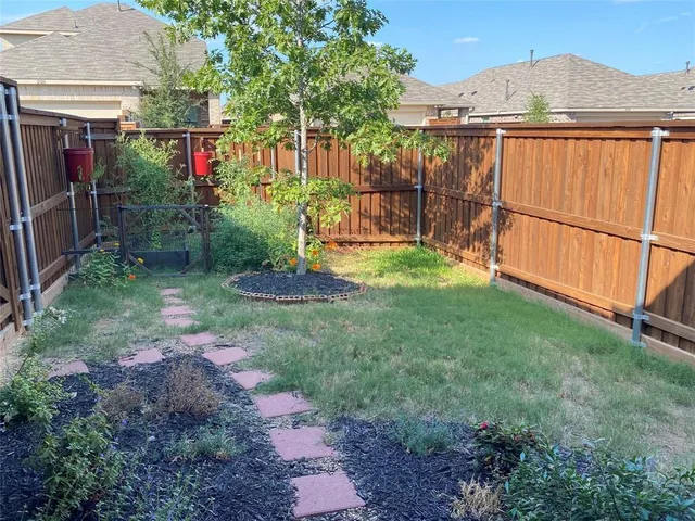a view of a backyard with garden