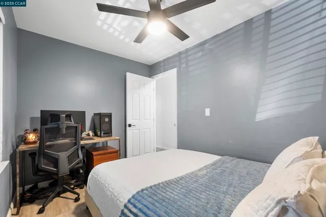 a bedroom with a bed and furniture