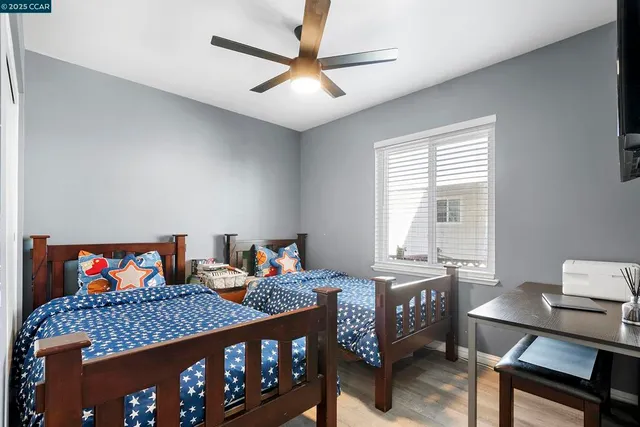 a bed room with furniture and a window