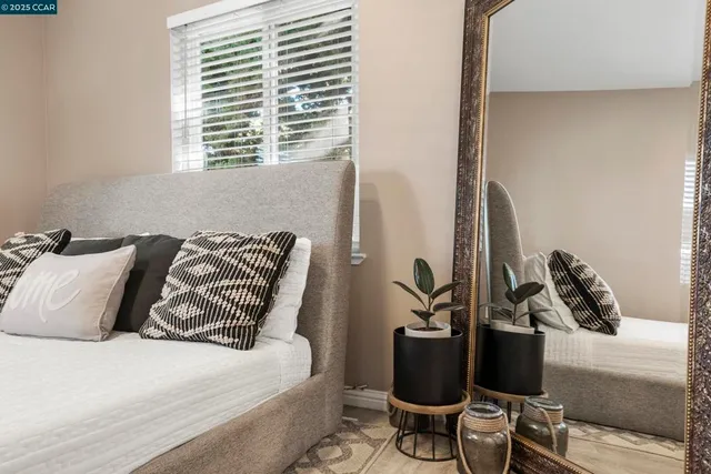 a bedroom with a bed and furniture