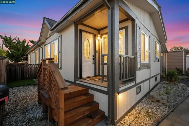 a view of a balcony with lots of stairs and wooden floor
