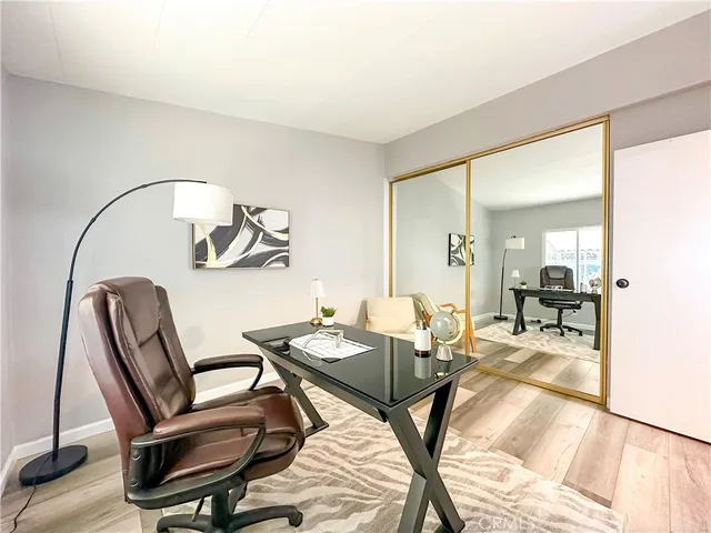 a view of a livingroom with furniture and a window