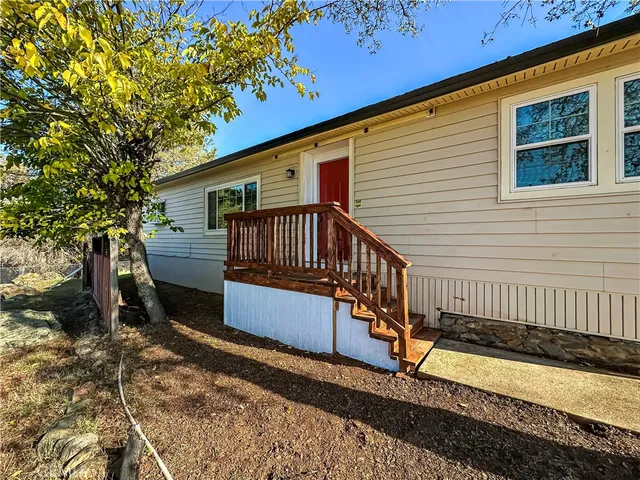 a living room with furniture potted plant and a window