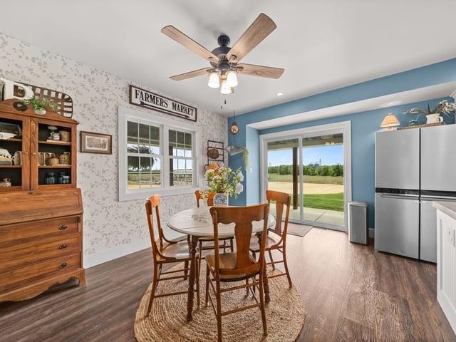 8294 North Leaf River Road Leaf River, IL 61047 - Photo 11 of 56 a dining room with furniture a chandelier and wooden floor