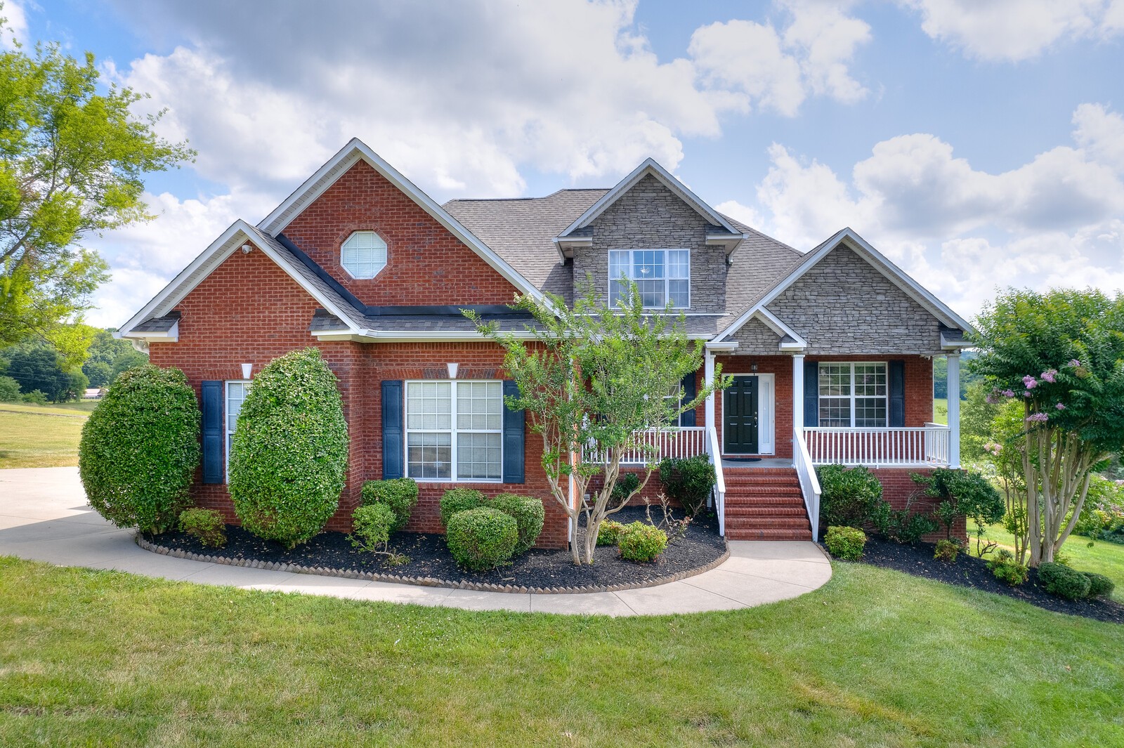 3036 Viewpointe Way Columbia, TN 38401 - Photo 1 of 35 a front view of a house with a yard and garage