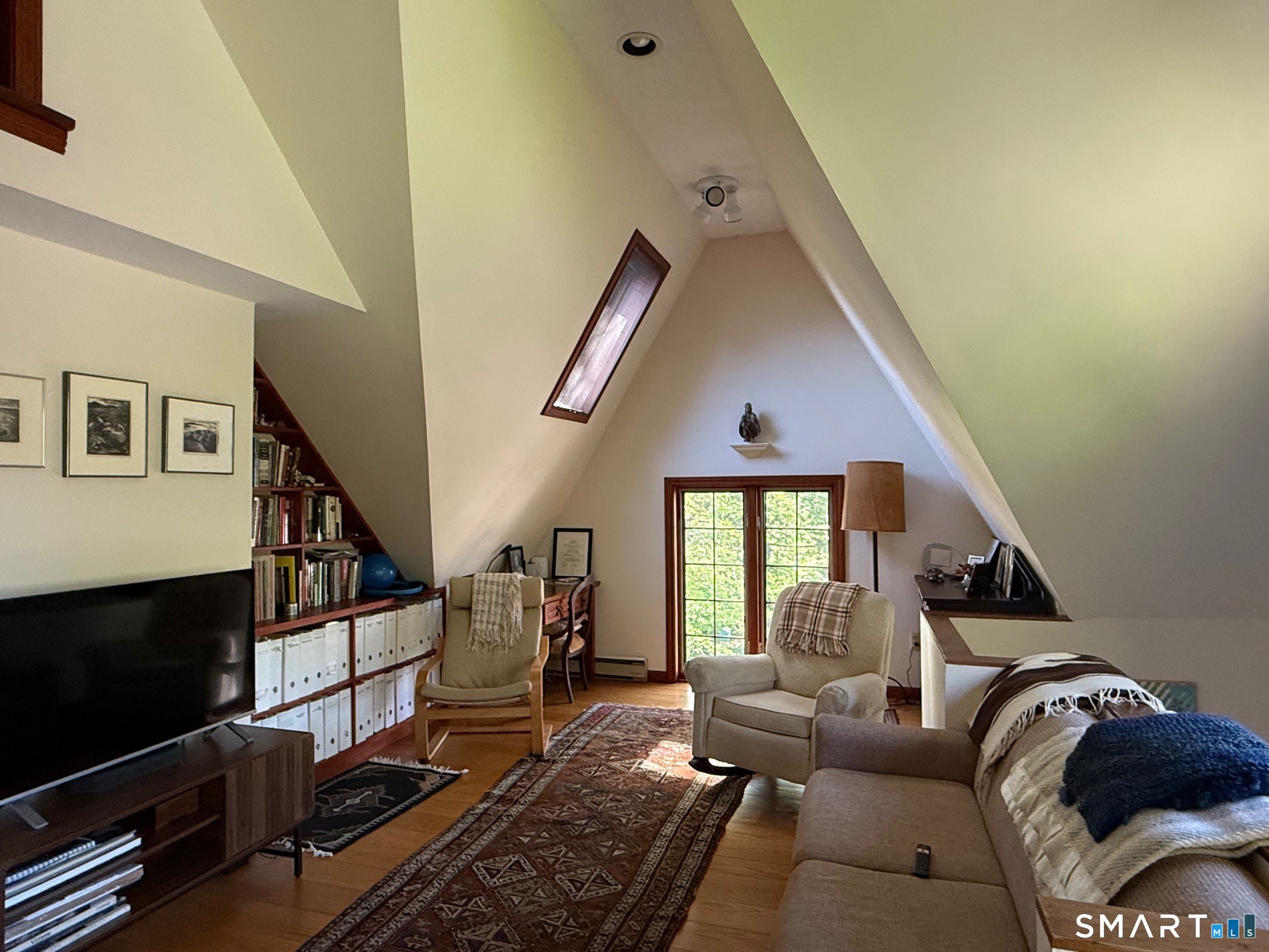 8 Ivy Road Stonington, CT 06355 - Photo 20 of 30 a living room with furniture and a flat screen tv