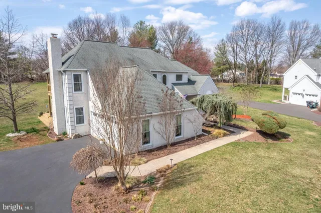 a view of staircase with white walls and a window