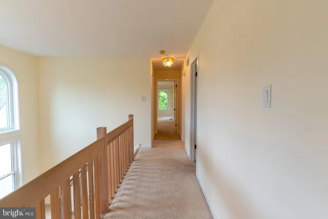 a bathroom with a double vanity sink toilet and mirror