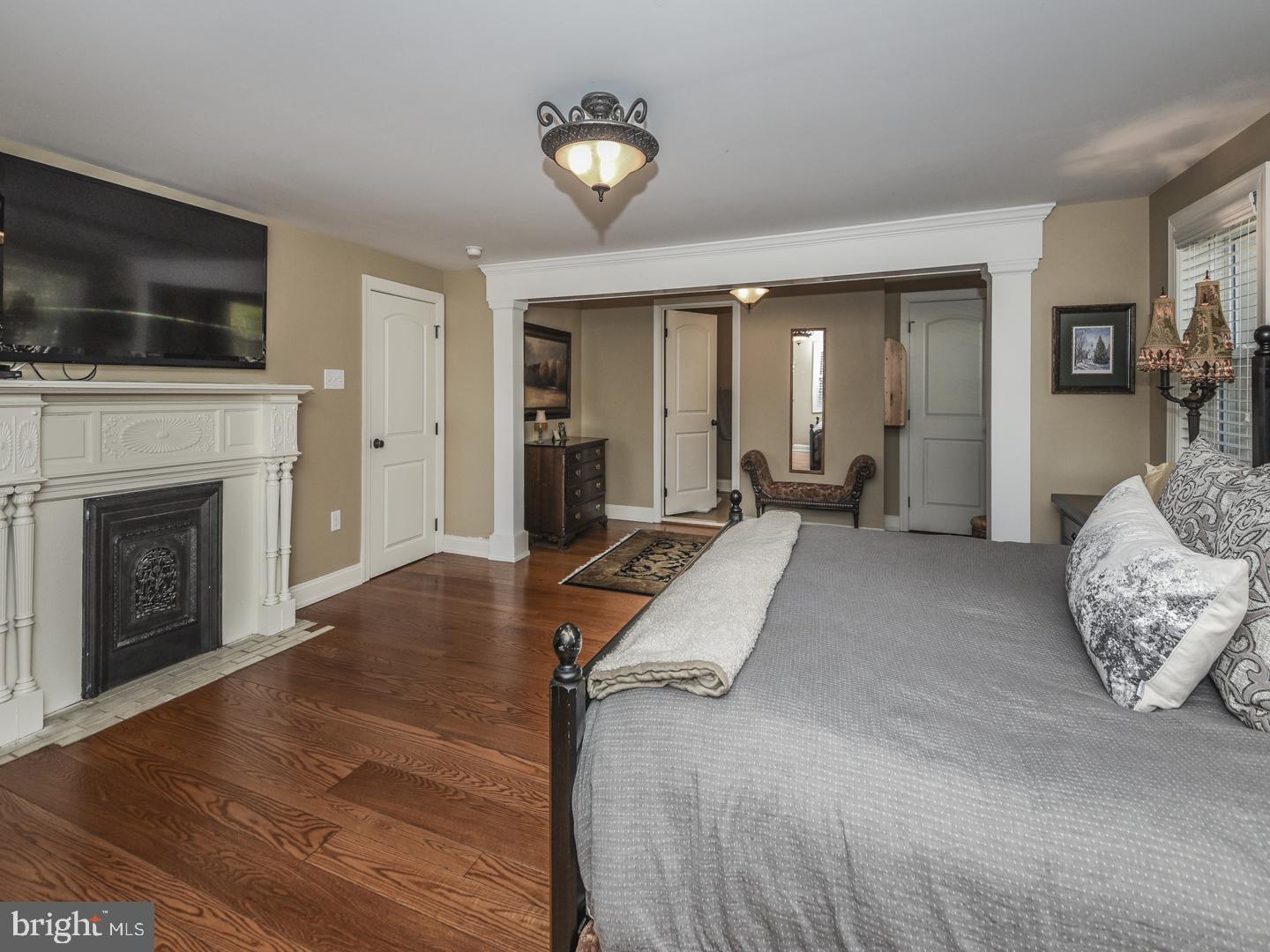908 Edgewood Road Yardley, PA 19067 - Photo 21 of 39 Master bedroom with fireplace