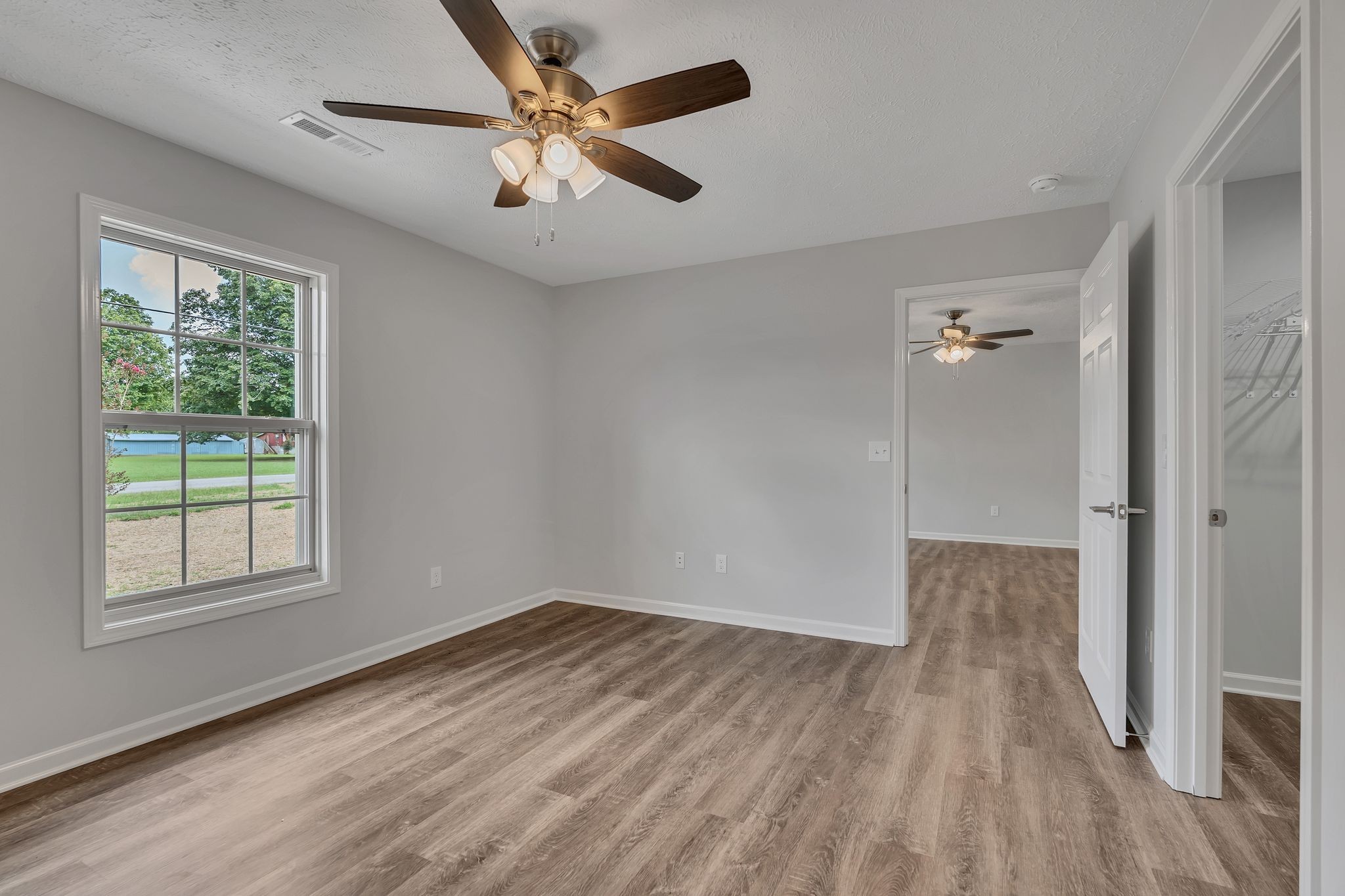 563 Paynes Church Road Winchester, TN 37398 - Photo 20 of 36 wooden floor in an empty room with a window