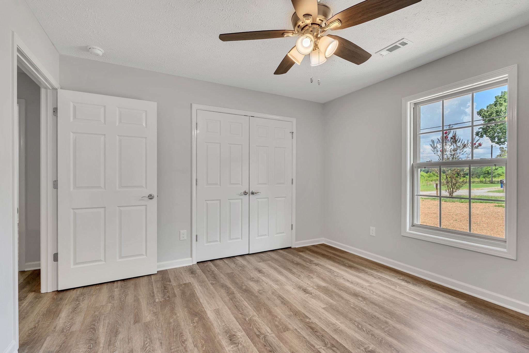 563 Paynes Church Road Winchester, TN 37398 - Photo 26 of 36 wooden floor in an empty room with a window