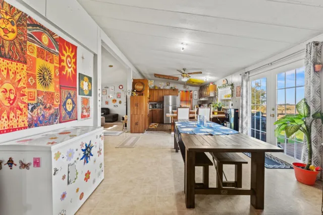 a dining hall with furniture and window