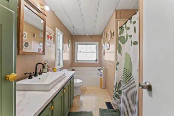 a bathroom with a sink a vanity and a mirror