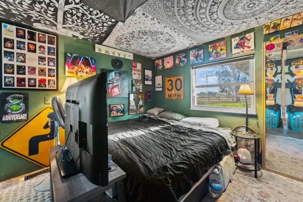 a bed room with a bed and a window