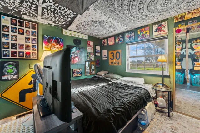 a bed room with a bed and a window