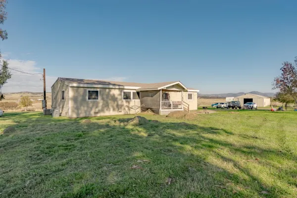 a house view with a garden space