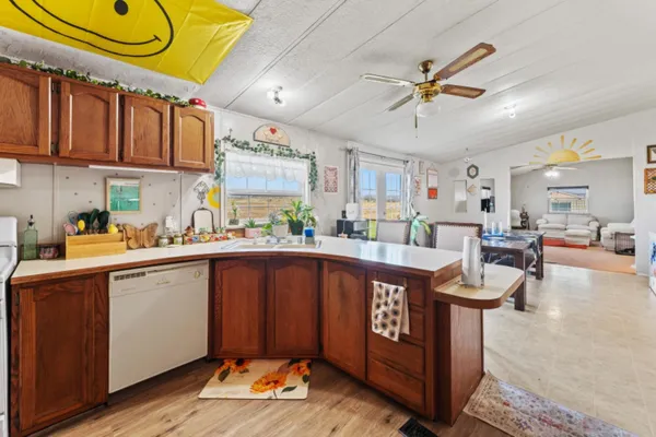 a kitchen with a cabinets a sink and appliances
