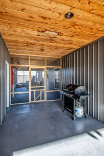 a view of a chairs and table in the patio