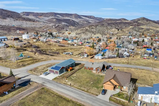 an aerial view of residential houses with outdoor space
