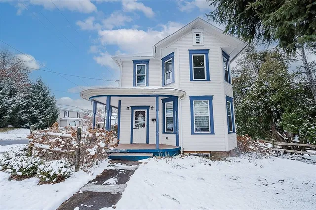 a front view of a house with a yard