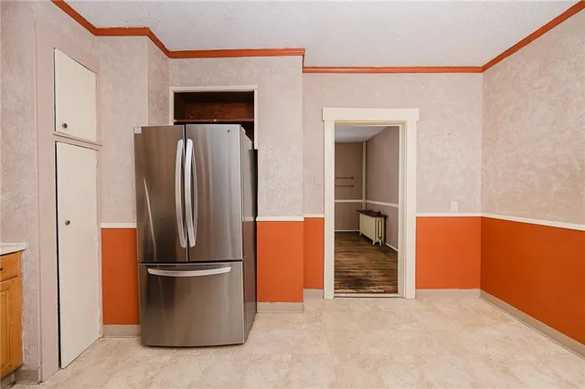 a view of a room with wooden floor and windows