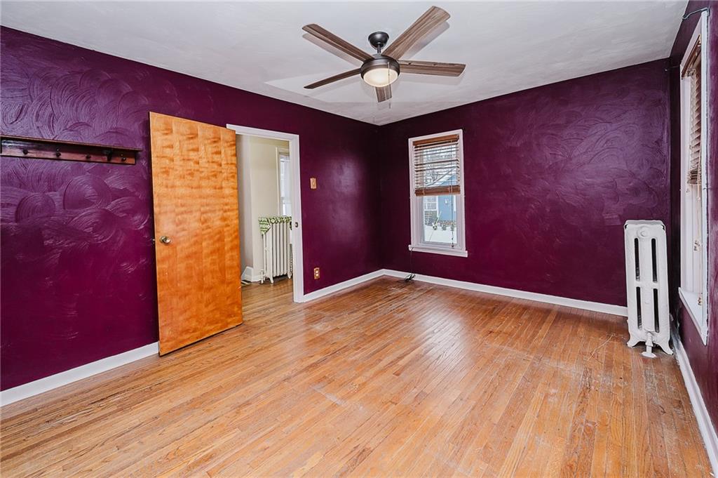 598 South 6th Street Indiana, PA 15701 - Photo 17 of 30 a view of empty room with wooden floor and fan