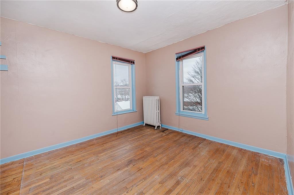 598 South 6th Street Indiana, PA 15701 - Photo 19 of 30 an empty room with wooden floor and windows