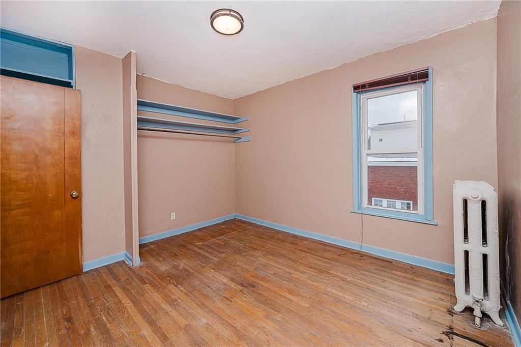 598 South 6th Street Indiana, PA 15701 - Photo 20 of 30 a view of an empty room with wooden floor and a window