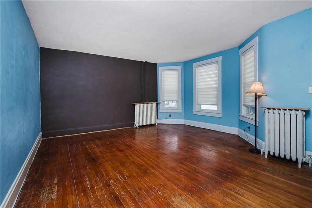 598 South 6th Street Indiana, PA 15701 - Photo 2 of 30 a view of an empty room with wooden floor and a window
