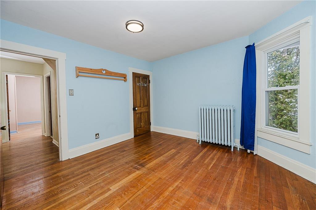 598 South 6th Street Indiana, PA 15701 - Photo 24 of 30 an empty room with wooden floor and windows