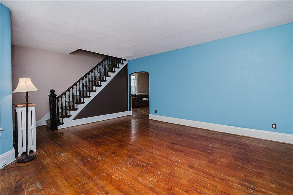 598 South 6th Street Indiana, PA 15701 - Photo 4 of 30 a view of an empty room with wooden floor and stairs