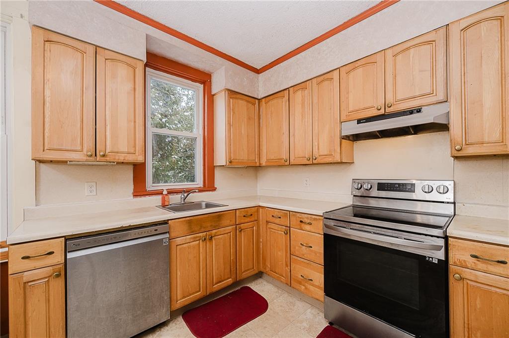 598 South 6th Street Indiana, PA 15701 - Photo 6 of 30 a kitchen with a sink stove and cabinets