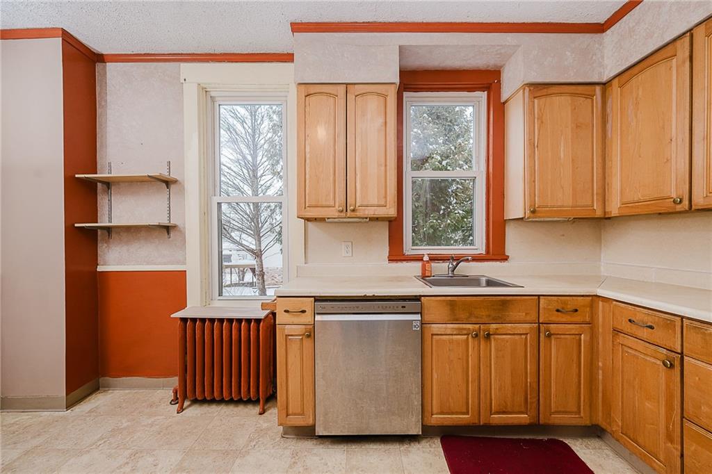 598 South 6th Street Indiana, PA 15701 - Photo 7 of 30 a kitchen with stainless steel appliances granite countertop a sink and a cabinets