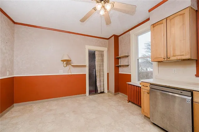 a view of kitchen with stainless steel appliances granite countertop cabinets and a refrigerator