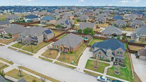 an aerial view of residential houses with outdoor space
