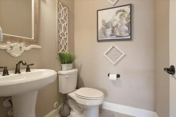 a bathroom with a toilet and a sink