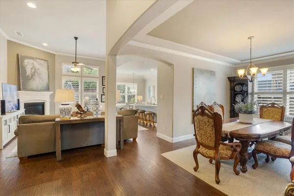 a view of a livingroom with furniture window and wooden floor