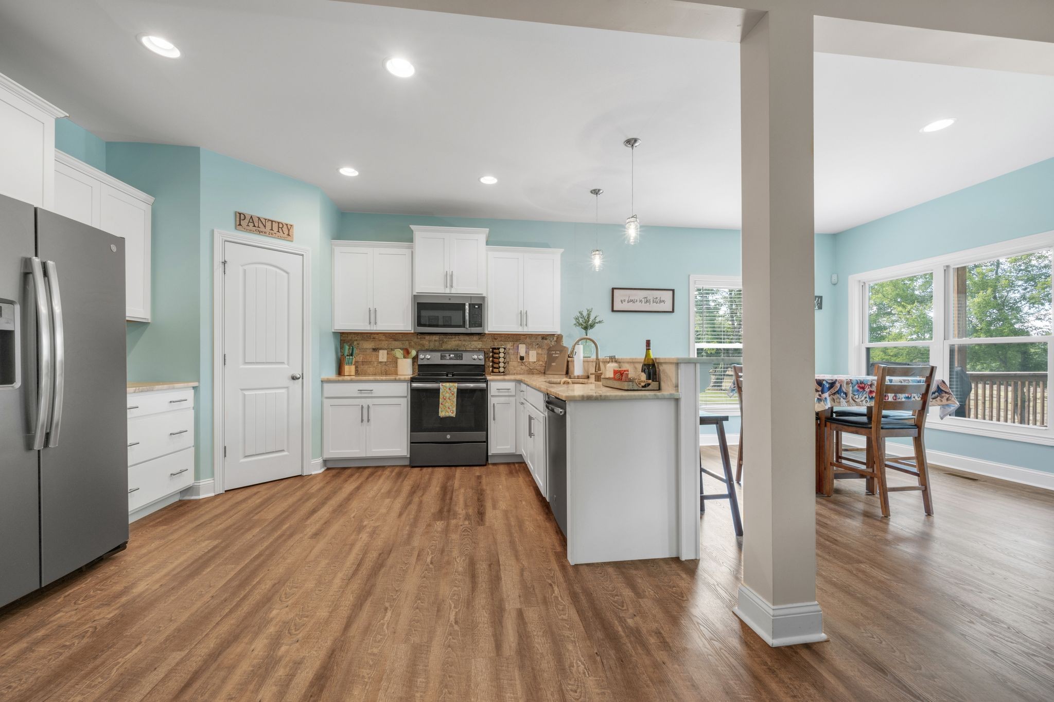 1640 Greenwood Road Charlotte, TN 37036 - Photo 2 of 37 Spacious kitchen with bar featuring SS appliances, granite & pantry