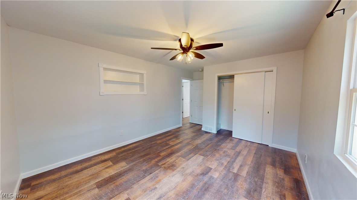 3075 Ludlow Road Cleveland, OH 44120 - Photo 16 of 30 Bedroom 2 with ceiling fan, a closet, and dark wood-type flooring