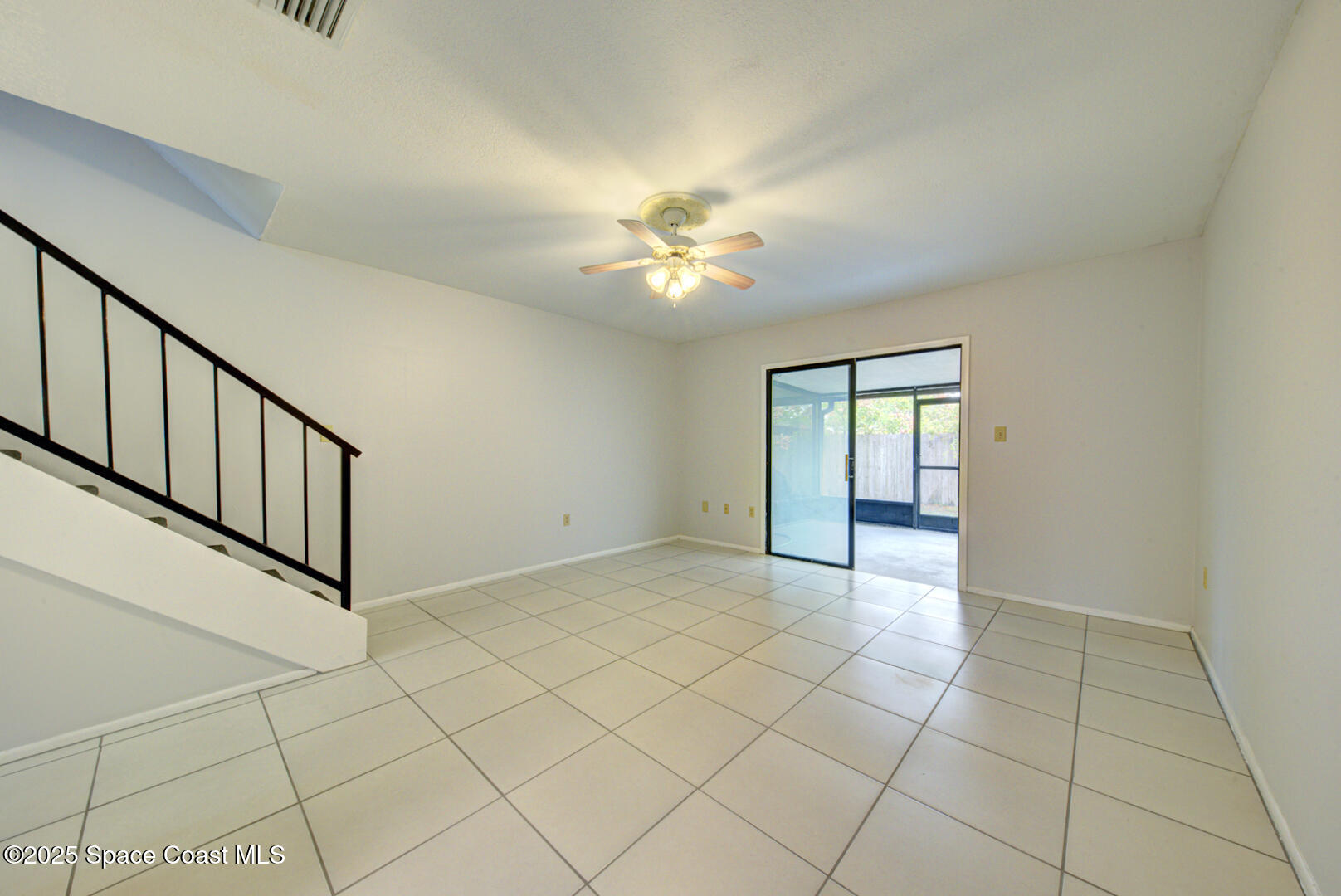4749 Sisson Road Titusville, FL 32780 - Photo 14 of 30 family room with slider to porch