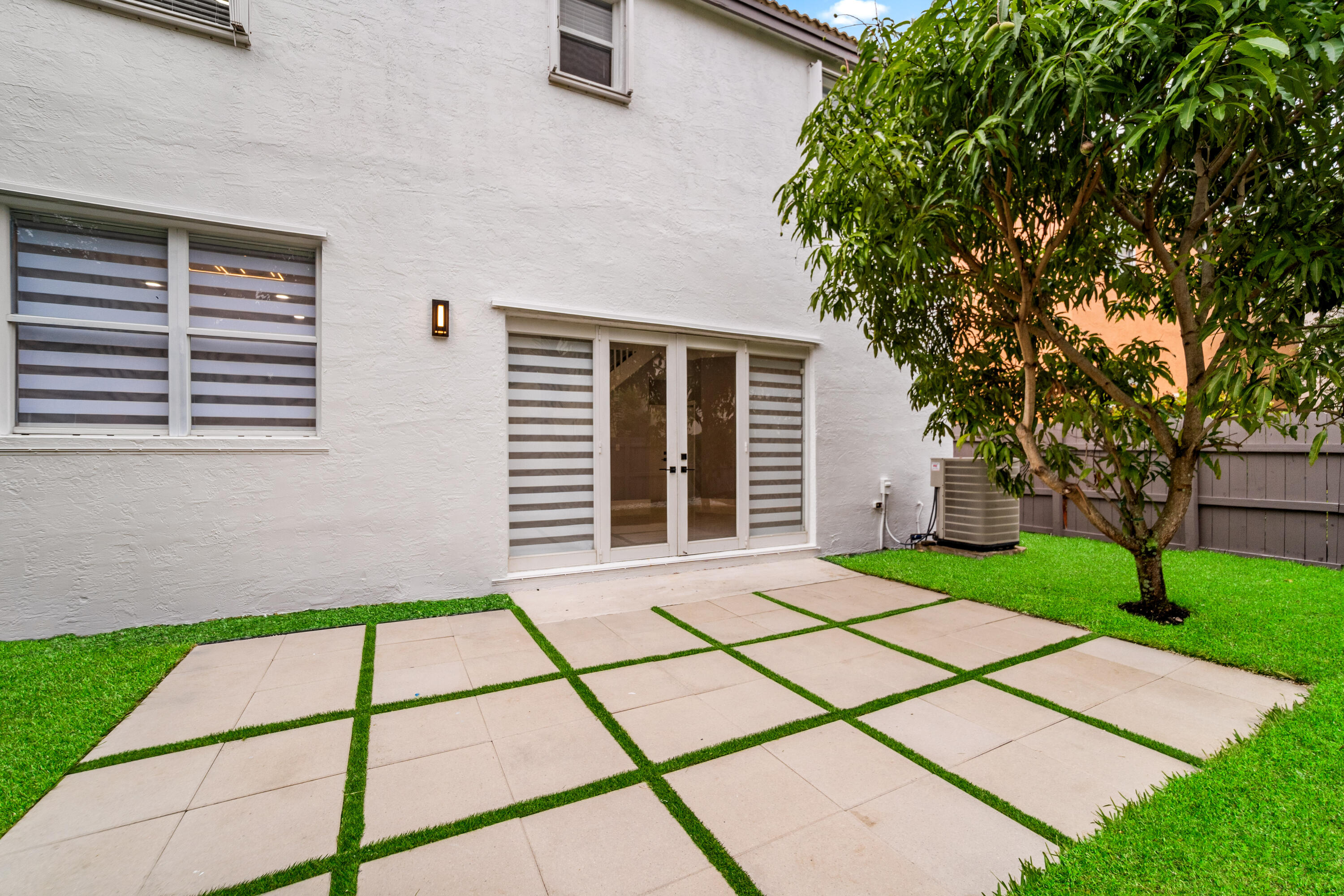 5233 Southwest 155th Way Miramar, FL 33027 - Photo 17 of 63 a front view of a house with a garden