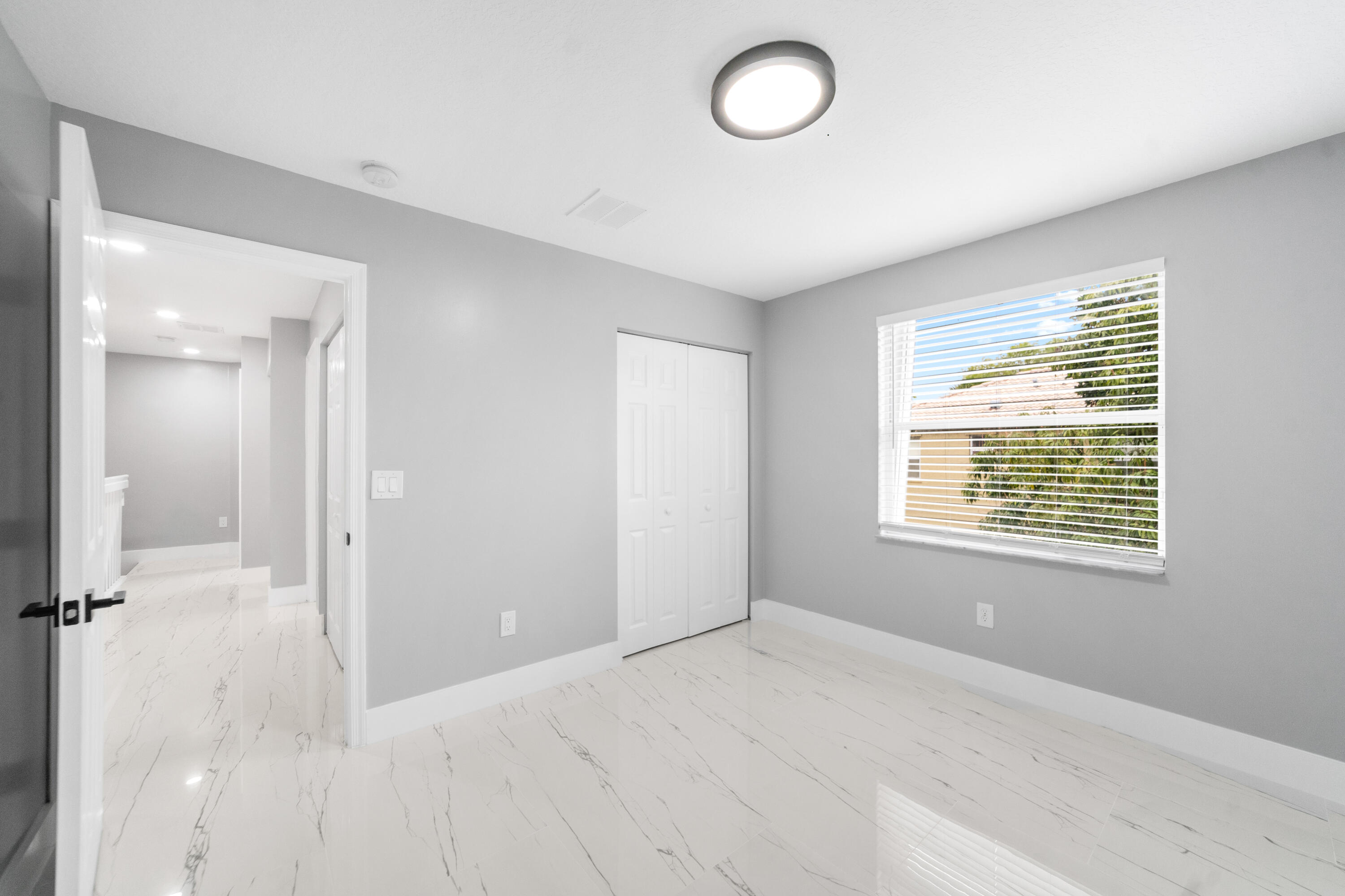 5233 Southwest 155th Way Miramar, FL 33027 - Photo 25 of 63 an empty room with windows