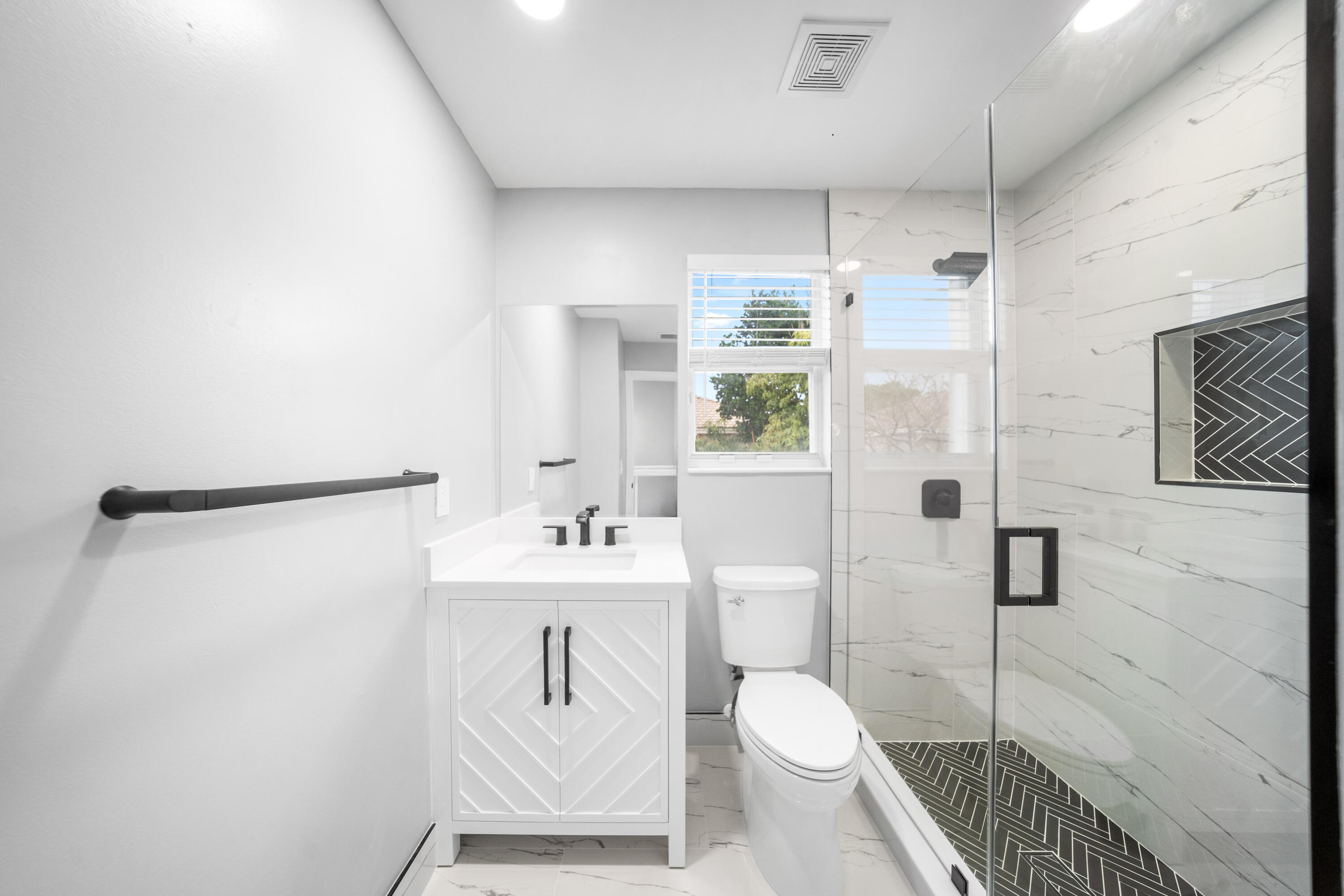 5233 Southwest 155th Way Miramar, FL 33027 - Photo 27 of 63 a bathroom with a toilet sink and shower